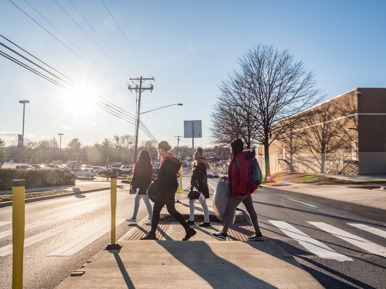 Pedestrians use a midblock crossing island in Aspen Hill